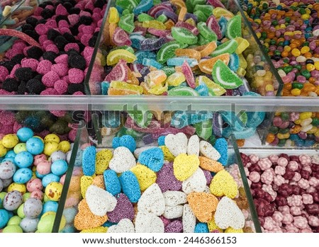 A variety of candy in a display case. Jelly sugar candies. Colorful Sweets on a market, candy shop.
 Royalty-Free Stock Photo #2446366153