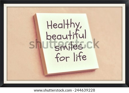 Text healthy beautiful smiles for life on the short note texture background