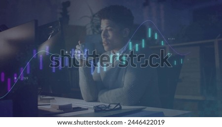 Image of data processing over biracial businessman working in office. Global business, finances, computing and data processing concept digitally generated image.