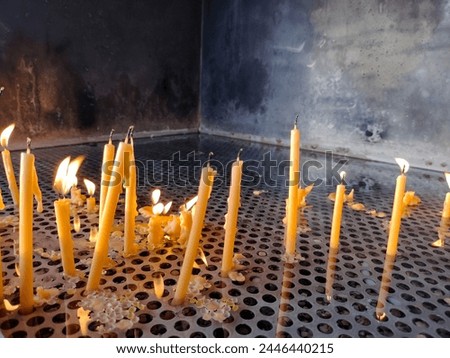 Burning candles during a mass at the evening