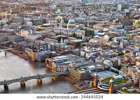 Aerial view over City of London, St Pauls cathedral, Thames river at sunset