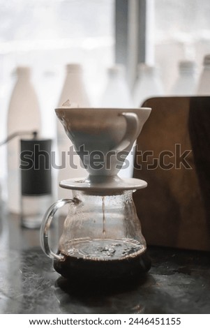 Light brown color theme V60 drip pour-over decanter, an alternative method of brewing coffee for a light-hearted mood picture
