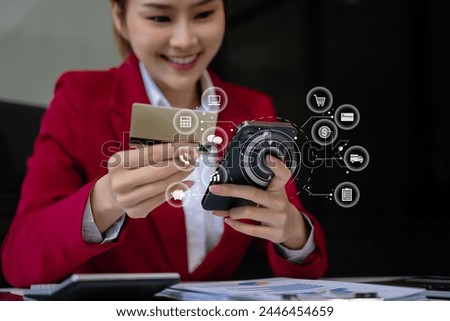 Businesswoman use computers and smartphone to pay through credit card payment channels. Online shopping Sit at the desk.