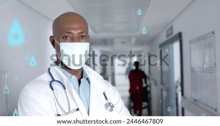 Image of network of medical icons and data processing over african american male doctor. Global science, medicine, research, computing and data processing concept digitally generated image.