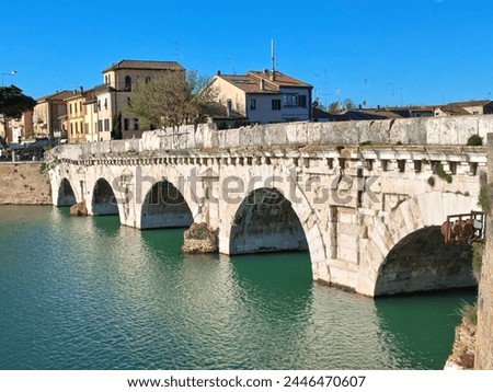 Discover the iconic Ponte di Tiberio, a Roman bridge spanning the River Marecchia in Rimini, Italy. Built in 20 AD, this majestic structure is a testament to Roman engineering and a must-see  Royalty-Free Stock Photo #2446470607