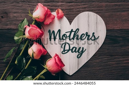 wood background on  Heart shaped mothers day card with roses 