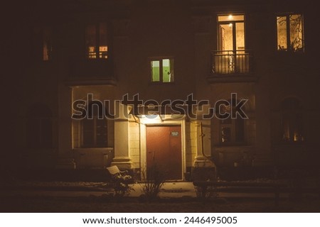 View of the facade of a residential apartment building in the evening, the light in the windows. Obninsk, Russia