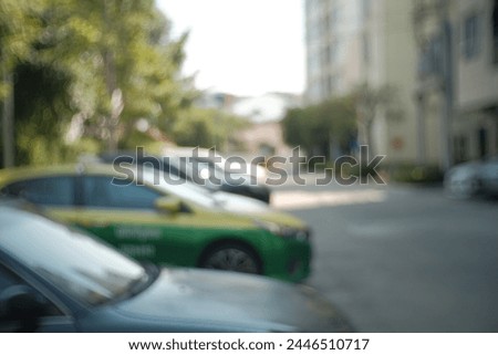 Blur focus of car in outdoor parking area.