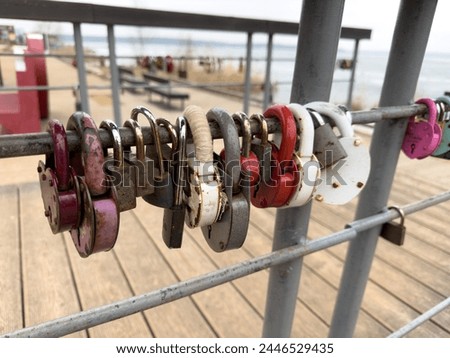 colorful locks hanging on the railings