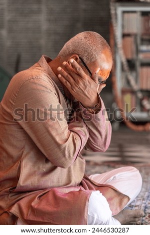 devotee praying for holy god at temple at morning from flat angle Royalty-Free Stock Photo #2446530287