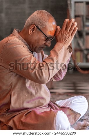 devotee praying for holy god at temple at morning from flat angle Royalty-Free Stock Photo #2446530299
