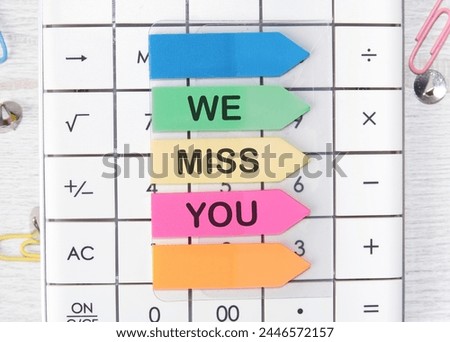 we miss you text written on arrow-shaped stickers