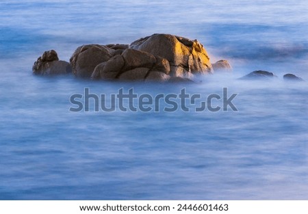 Sunrise light on the rock, long exposure. Méditerranean sea, Corsica, France