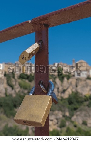 Padlocks tied symbolizing the union of people on the railings of the San Pablo bridge in the province of Cuenca.