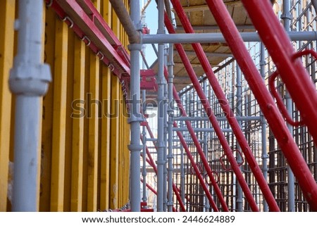 Vertical panel formwork, push-pull jacks and scaffoldings of reinforced concrete walls under construction. Structures for cast in place reinforced concrete Royalty-Free Stock Photo #2446624889