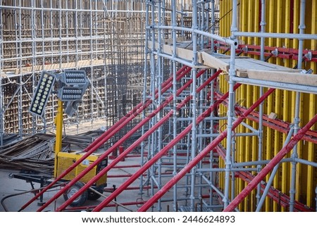 Vertical panel formwork, push-pull jacks and scaffoldings of reinforced concrete walls under construction. Structures for cast in place reinforced concrete Royalty-Free Stock Photo #2446624893