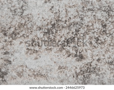 a picture of white concrete surface with dirty stain 
