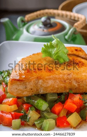Gourmet Delight: Close-Up 4K Ultra HD Picture of Pan-Grilled Yellowtail Fish with Sautéed Vegetables