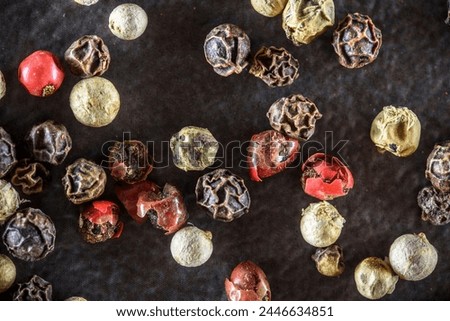 Dark Elegance: Captivating 4K Ultra HD Picture of Peppercorns Against Dark Background Royalty-Free Stock Photo #2446634851