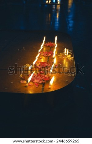 Candles lit in a church for Easter at Chichicastenango in Guatemala