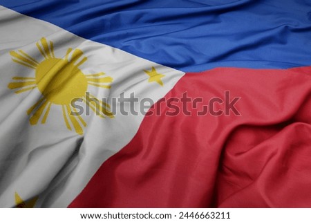 waving colorful national flag of philippines. macro shot