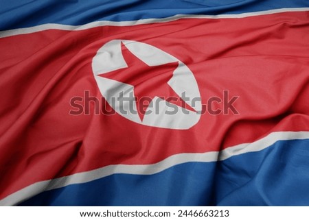waving colorful national flag of north korea. macro shot