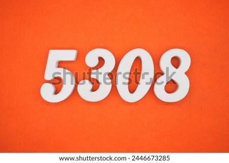 Orange felt is the background. The numbers 5308 are made from white painted wood.