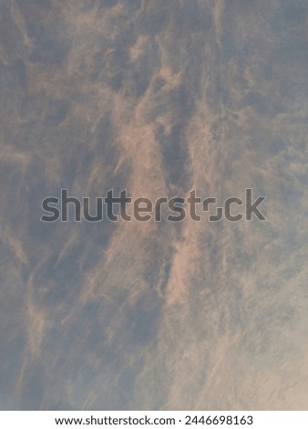 Ultimate pink stratus clouds shining at the morning sky