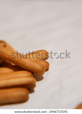 Material advertisement lettering finger biscuit Royalty-Free Stock Photo #2446715545