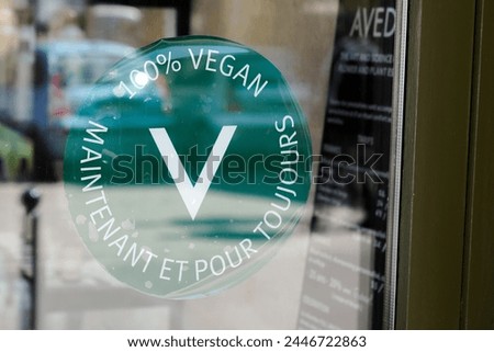 100% vegan maintenant et pour toujours french text sign green sticker means v lettering 100 % vegan now and forever