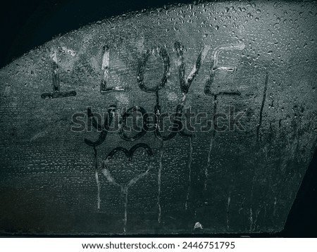 Romantic Message on Misted Window”

Capture the essence of romance and affection with this evocative image. The words “I LOVE you” are tenderly inscribed on a misted window, each letter etched with em