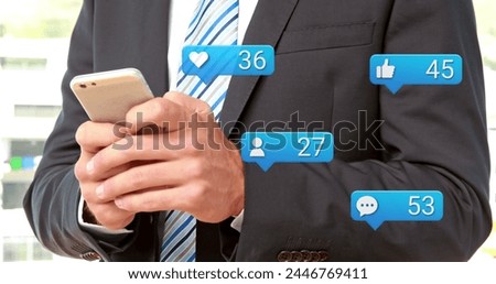 Image of social media reactions over hands of caucasian businessman using smartphone. Social media, network, communication and technology concept digitally generated image.