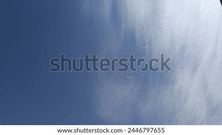 a half blue clear sky and the other half is slightly cloud Royalty-Free Stock Photo #2446797655