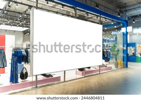 Mockup horizontal blank LED billboard or lightbox on glass panel at fashion clothes shop in mall, Empty space for insert media advertisement, discount, special price and promotion near corridor
