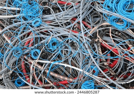 old copper and PVC electrical cables for separate waste collection and material recycling in the recycling center Royalty-Free Stock Photo #2446805287