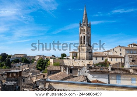Views of old houses and narrow hilly streets of medieval town St. Emilion, production of red Bordeaux wine on cru class vineyards in Saint-Emilion wine making region, France, Bordeaux Royalty-Free Stock Photo #2446806459