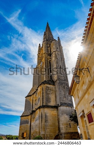Views of old houses and narrow hilly streets of medieval town St. Emilion, production of red Bordeaux wine on cru class vineyards in Saint-Emilion wine making region, France, Bordeaux Royalty-Free Stock Photo #2446806463