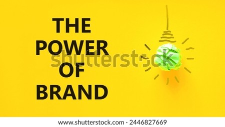The power of brand symbol. Concept words The power of brand on beautiful yellow paper. Beautiful yellow background. Green light bulb icon. Business the power of brand concept. Copy space.