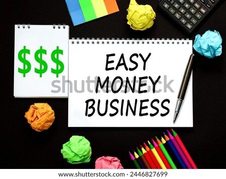 Easy money business symbol. Concept words Easy money business on beautiful white note. Beautiful black background. Black pen. Colored paper. Calculator. Easy money business concept. Copy space.