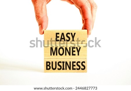 Easy money business symbol. Concept words Easy money business on beautiful wooden blocks. Beautiful white table white background. Businessman hand. Easy money business concept. Copy space.