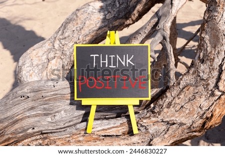 Think positive symbol. Concept words Think positive on beautiful black yellow blackboard. Beautiful tree background. Business, motivational think positive thinking concept. Copy space. Royalty-Free Stock Photo #2446830227