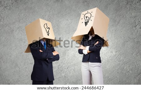 Unrecognizable business people wearing carton boxes on head