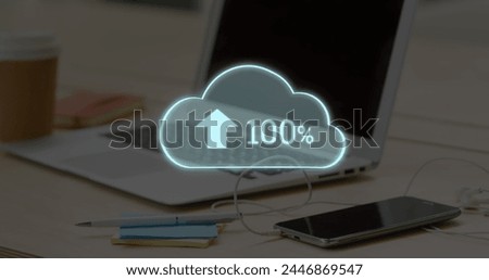 Digital composite of working table with a laptop, pen, sticky notes, mobile phone, and a coffee cup. Digital image of uploading in a semi-transparent digital cloud at the middle. 4k