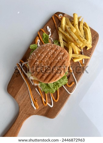 Classic Veg hamburger with aloo tikki, sauce and french fries