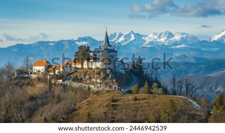 Pilgrimage site Sveta gora in Zasavje with Kamnik-Savinja Alps in background, Slovenia Royalty-Free Stock Photo #2446942539