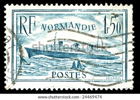vintage french stamp depicting the launch of the passenger liner SS Normandie in 1932. she is considered to be one of the greatest Ocean liners ever built