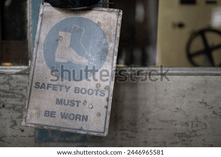 View of a sign to wear steel cap boots
