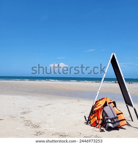 Life jackets, vests, safety, beach, sea, lifeguards, swim, swim, recreation, background, print, view, nature, print, beach without people, blue sky, blue sea, yellow sand, white sand, tenderness
