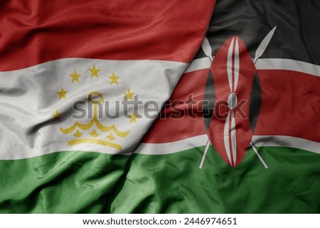 big waving national colorful flag of kenya and national flag of tajikistan. macro