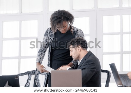 Corporate business team and manager in meeting. Diversity of business people of African and Latin women and Caucasian men are working together. Senior boss are consulting team at clean interior room. Royalty-Free Stock Photo #2446988141